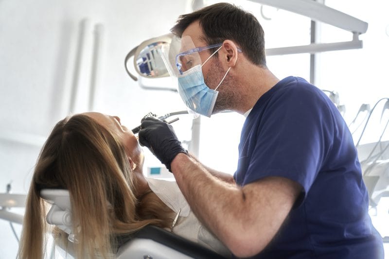 Patient receiving emergency dental care near Plymouth