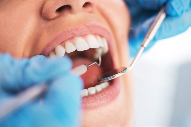 Patient getting routine dental examination near plymouth